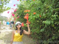 Joann smells the flowers at Orchid World Barbados.jpg
