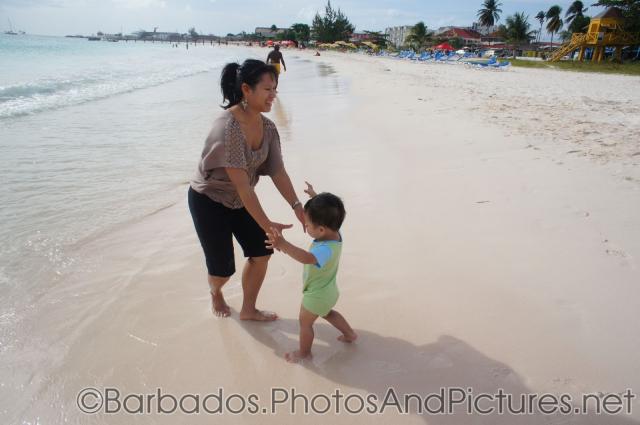 Darwin walks to mommy at Carlisle Bay Beach in Bridgetown Barbados.jpg
