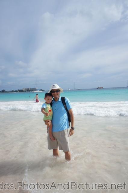 Darwin held by daddy at Carlisle Bay Beach in Bridgetown Barbados.jpg
