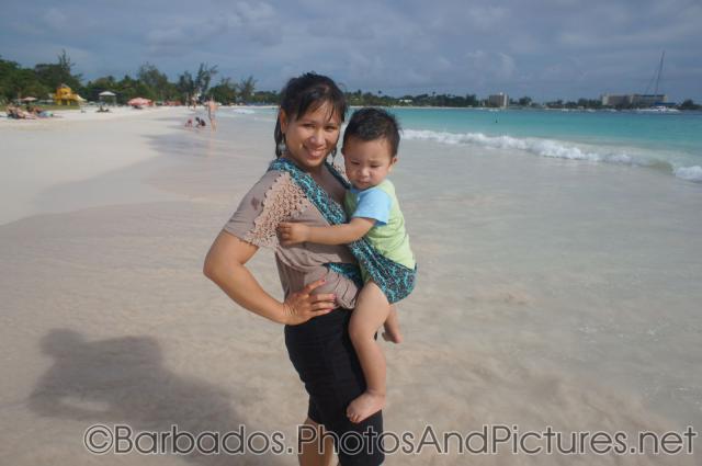 Darwin being held by mommy at Carlisle Bay Beach in Bridgetown Barbados.jpg
