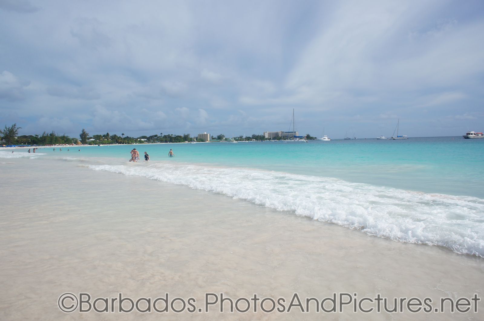 Wave meets white sand at Carlisle Bay Beach in Bridgetown Barbados.jpg
