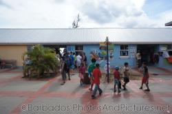 Shoppers gather around shops at the Cruise Port Terminal in Bridgetown Barbados.jpg
