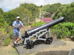 David points at canon at Gun Hill Signal Station in Barbados.jpg
