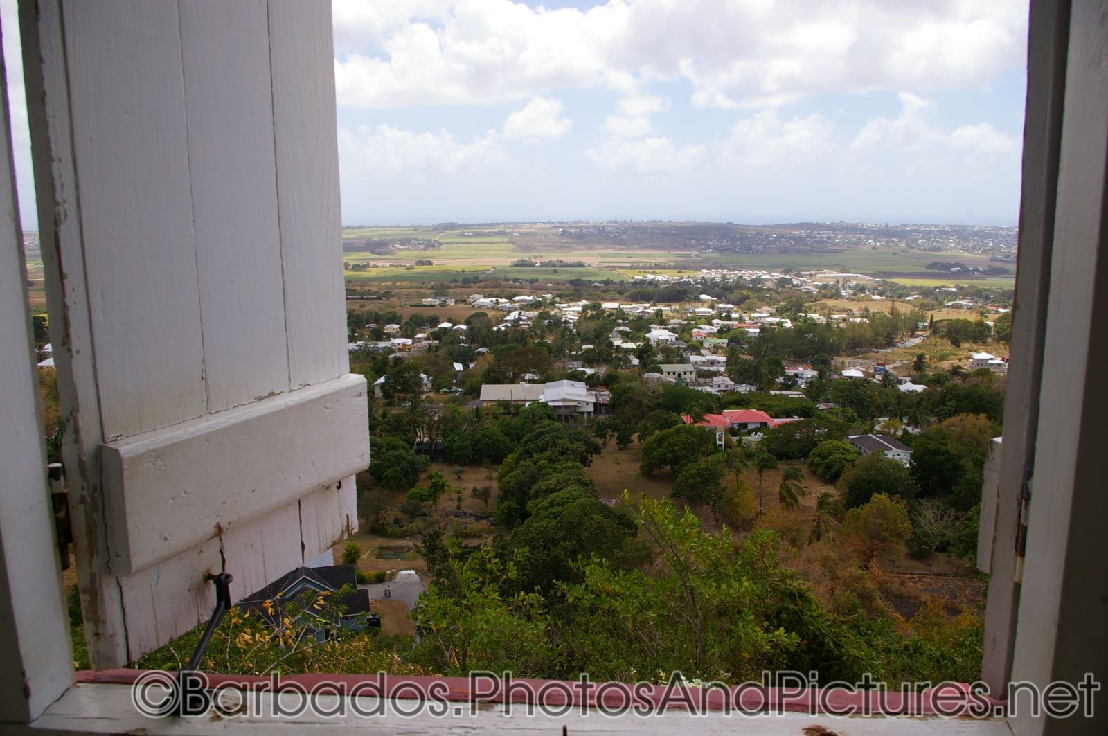Looking out through a window at the Gun Hill Signal Station tower in Barbados.jpg
