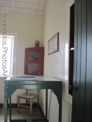 Green talbe and red cabinet inside Gun Hill Signal Station in Barbados.jpg