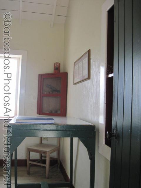 Green talbe and red cabinet inside Gun Hill Signal Station in Barbados.jpg
