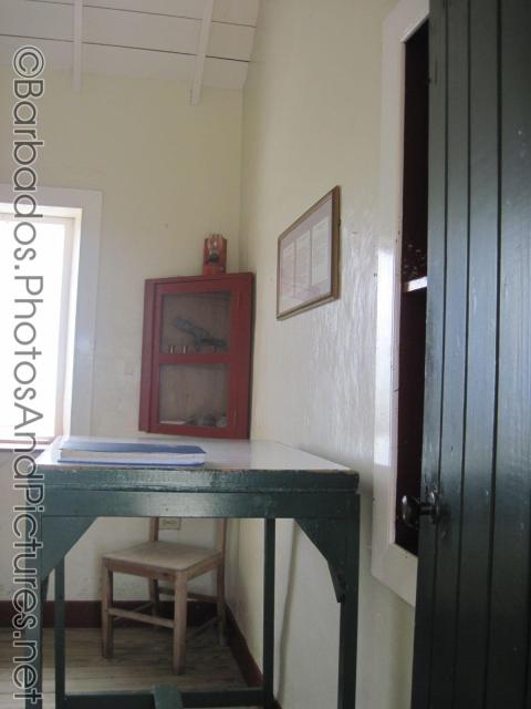 Green talbe and red cabinet inside Gun Hill Signal Station in Barbados.jpg