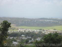Houses and buildings in the distance as viewed from Gun Hill Signal Station in Barbados.jpg

