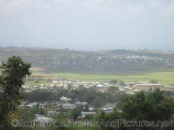 Houses and buildings in the distance as viewed from Gun Hill Signal Station in Barbados.jpg