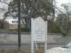 Tyrol Cot sign indicating open and close hours in Barbados.jpg