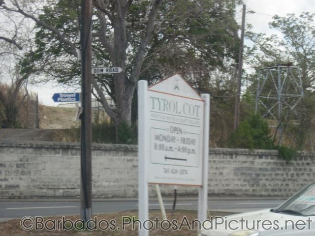 Tyrol Cot sign indicating open and close hours in Barbados.jpg