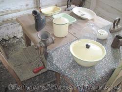 Table with iron and tools and kitcheware inside a cottage of Tyrol Cot in Barbados.jpg