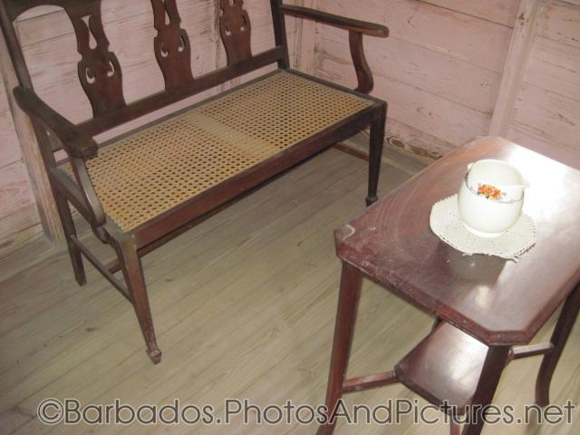 Chair and small table inside a cottage of Tyrol Cot in Barbados.jpg
