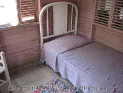 Small bed in a cottage at Tyrol Cot in Barbados.jpg
