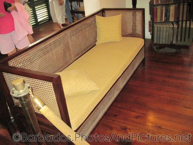 Sofa with yellow cushion at Tyrol Cot in Barbados.jpg